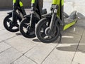 Close-up of electric scooter wheels on pavement Royalty Free Stock Photo