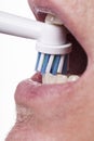 Close up of electric toothbrush and paste on white Royalty Free Stock Photo