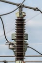 Close-up of an electrical insulator on a power transmission line. Royalty Free Stock Photo