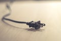 Close up of an electrical plug on wood table Royalty Free Stock Photo