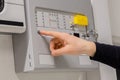 Close-up of electrician Checking Fire Alarm Panel In Datacenter Royalty Free Stock Photo