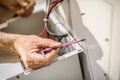 Close up of electrician engineer works with electric cable wires Royalty Free Stock Photo