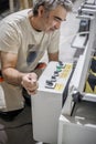 Close up of electrician engineer works with electric cable wires Royalty Free Stock Photo