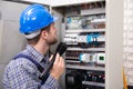 Electrician Examining A Fuse Box