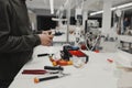 Close-up of a electrician reparing on the production line at the factory