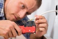 Close-up of electrician stripping wires