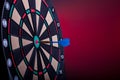 Close up of an electronic dart board and blue arrow Royalty Free Stock Photo