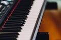 Close up electronic musical keyboard synthesizer with white and black keys. With copy space Royalty Free Stock Photo