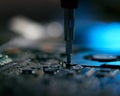 Close Up Of Electronics Expert Repairing Laptop In Workshop Using Screwdriver With Low Key Lighting Royalty Free Stock Photo