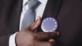 Close up, elegant african american man having european union badge on his suit