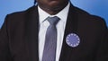 Close up, elegant african american man having european union badge on his suit