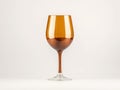 Elegant Amber Wine Glass on White Background. Royalty Free Stock Photo