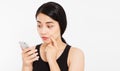 Close up - elegant beautiful asian girl talking with somebody on cellphone Royalty Free Stock Photo