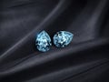 Close up of elegant blue diamonds on black fabric background