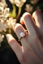 Close up of an elegant diamond ring on young woman finger