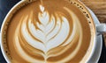 Close Up Elegant Latte Art in a White Ceramic Cup.