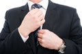 Close-up of elegant man adjusting his tie wearing suit Royalty Free Stock Photo