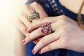 Close up of an elegant ring with stones on woman`s hands. concept of wealth, jewelry.