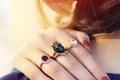 Close up of an elegant ring with stones on womans hands. concept of wealth, jewelry.