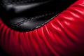 Close-up elements of red boxing leather gloves