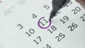 Close-up of the eleventh day of the calendar signed with a purple pen Royalty Free Stock Photo