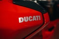 Emblem of Ducati on a sport red motorcycle.