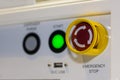 Close up emergency stop button on control panel of machine for safety at factory