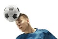 Close up of emotional man playing soccer hitting the ball with the head on isolated white background Royalty Free Stock Photo