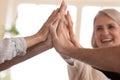 Close up employees giving high five after making business decision. Royalty Free Stock Photo