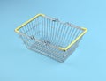 Close up of empty chrome wire basket on blue background Royalty Free Stock Photo