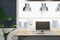 Close up of empty computer screen on wooden office desktop with objects, lamp and supplies on panoramic window and city view Royalty Free Stock Photo