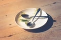 Close up empty dirty dish on wooden table. Royalty Free Stock Photo