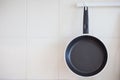 Close up empty frying pan hanging on the kitchen wall Royalty Free Stock Photo