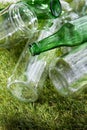 close up of empty glass bottles and jars on grass Royalty Free Stock Photo