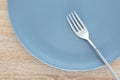 Close-up empty plate and fork on table Royalty Free Stock Photo