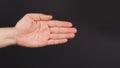 Close up of empty left hand palm and Finger close on black background Royalty Free Stock Photo