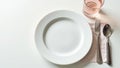 Close up of empty plate, fork, and glass on white , fasting, diet Royalty Free Stock Photo