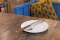 Close up of Empty plate, fork, spoon on table Royalty Free Stock Photo