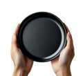 Close-Up of Empty Plate Held by Hands Isolated on White Background Royalty Free Stock Photo