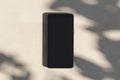 Close up of empty smartphone on light surface with leaf shadows. Presentation concept. Mock up Royalty Free Stock Photo