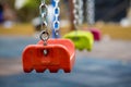 Close up of empty swing in a children play area at park Royalty Free Stock Photo