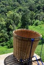 Close up of empty tea baskets for tea harvesting on tea plantations terrace background. Royalty Free Stock Photo