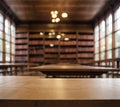 Close-up empty Top of wooden table with Blurred the libraryn  background can used for display or montage your product. Royalty Free Stock Photo