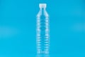 Close up of an empty used plastic bottle on blue background,Recyclable waste Royalty Free Stock Photo