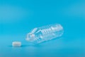 Close up of an empty used plastic bottle on blue background,Recyclable waste Royalty Free Stock Photo