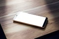 Close up of empty mobile phone on wooden table. Mock up, 3D Rendering Royalty Free Stock Photo