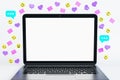 Close up of empty white mock up notebook screen with colorful social media icons on light background. Communication, follow and