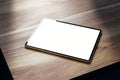 Close up of empty tablet on wooden table. Mock up, 3D Rendering Royalty Free Stock Photo