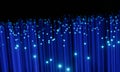 Close up on the ends of many illuminated blue fibre optic strands with many unfocussed bokeh effects against black background. 3D Royalty Free Stock Photo