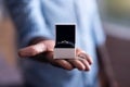 Close up of engagement ring held by African man Royalty Free Stock Photo